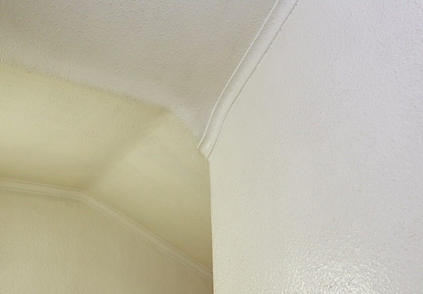 Plasterwork on the ceiling around the lower step and the landing on the 1st floor